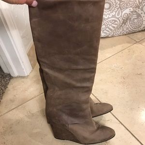 Tall, distressed wedge boots